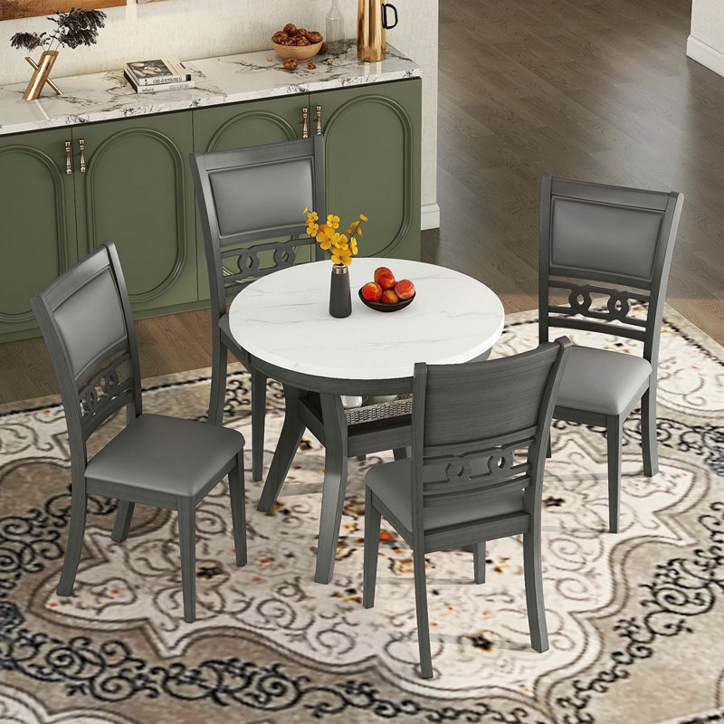 Ensemble de table ronde 5 pièces avec une table de salle à manger en faux marbre et quatre chaises en similicuir