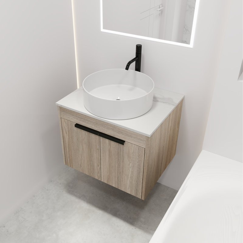 Meuble-lavabo moderne en chêne blanc. Fixation murale 24 po avec cuve en céramique. Porte à fermeture en douceur pour un évier de rangement tentant et spacieux. Espace