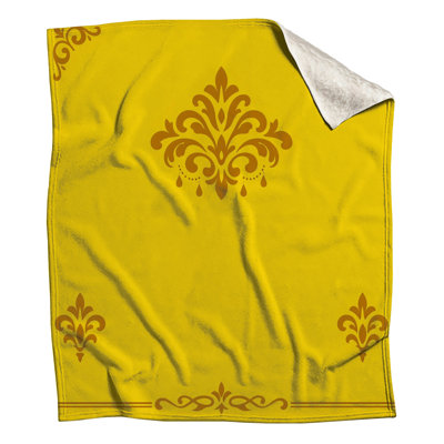 Couvertures jaunes à motifs damassés