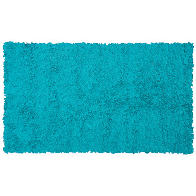 Tapis bleu sarcelle fait à la main