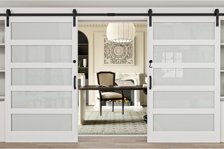 home office with double white sliding barn doors featuring frosted glass panels