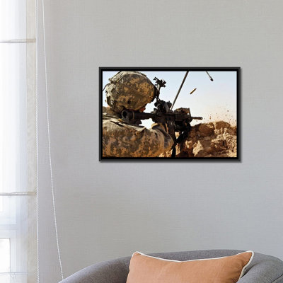 " US Army Soldier Engages Enemy Forces In A Small Arms Fire Fight In Afghanistan " by Stocktrek Images