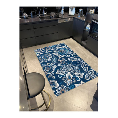 Tapis bleu lavable décoratif à motif floral bleu