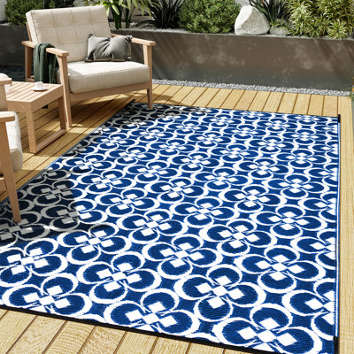 Tapis d'extérieur à motif géométrique floral bleu