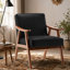 Chaise d'appoint Mid-Century moderne en similicuir noir - compacte et élégante pour tout espace de vie