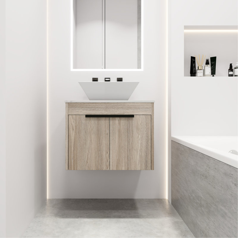 Meuble-lavabo mural. Style moderne 24 po avec lavabo en céramique. Chêne blanc. Porte à fermeture en douceur. De nombreuses options de rangement pour les salles de bain. Poignée en métal. Ardoise 24 po. Grand choix de cuves.