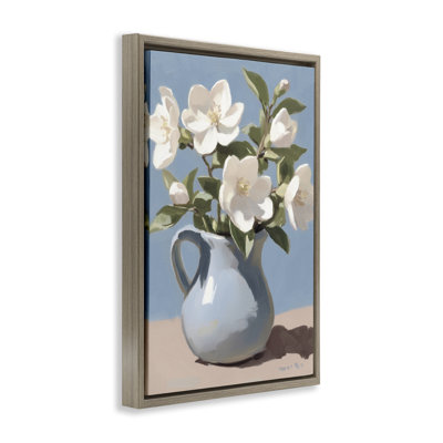 Arrangement ivoire dans un cadre flottant bleu, design par Gina Kelly