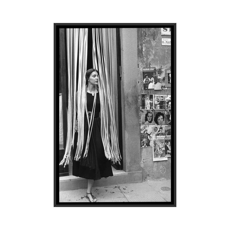 American Girl Series Jinx In Beads (Florence, Italy 1951) by Ruth Orkin - Print on Canvas, Black Framed