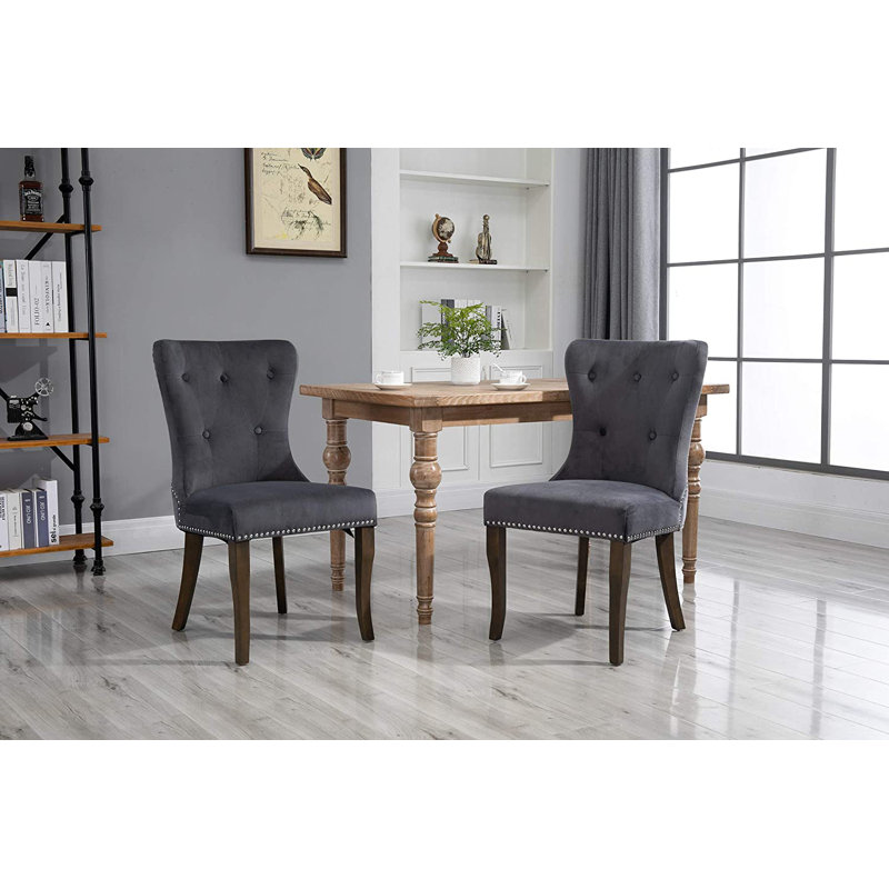 Chaise de salle à manger rembourrée en gris à oreilles capitonnée Dupras, Gris