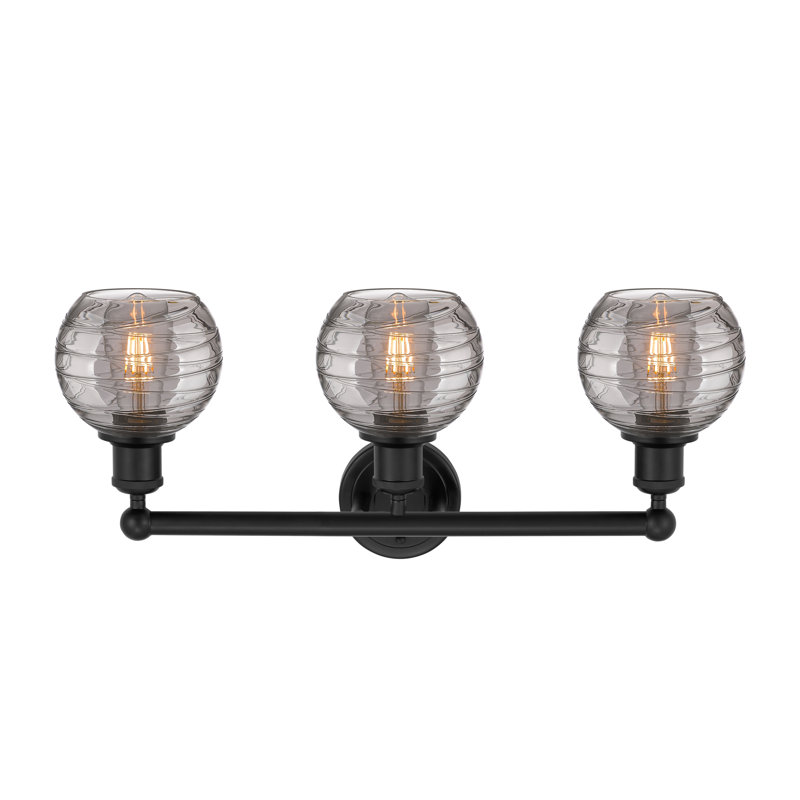 Cambria Deco Swirl 3 Light 24 Inch Bath Vanity Light, Matte Black, Clear