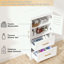 Armoire de rangement avec 2 tiroirs, 2 portes et tablette réglable