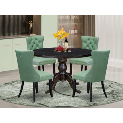 L'ensemble de salle à manger 5 pièces comprend une table ronde de 48 po avec piédestal et 4 chaises rembourrées en tissu de polyester vert saule, noir sablé