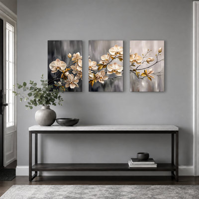 Orchidées crème avec feuilles dorées sur fond gris, ensemble de 3 toiles