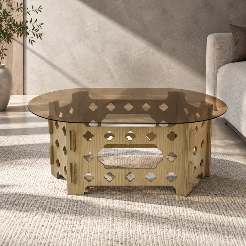 Table basse ovale de 98 x 58 cm avec dessus en verre caramel et piètement en bois sculpté