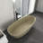 66.9*29.5*21.7 Inch Freestanding Bathtub With Solid Surface, Matte Finish, Oval Shape, Center Drain, Modern Luxury Aesthetics 66.9 Soaking Tub Khaki Matte, Minimalist Style, Ergonomic Design
