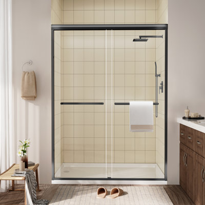 Porte de douche coulissante encadrée en noir mat avec verre transparent