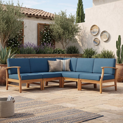 Ensemble de salon de jardin modulaire de 5 pièces en bois d'acacia avec coussins résistants à l'eau, idéal pour terrasse ou jardin.