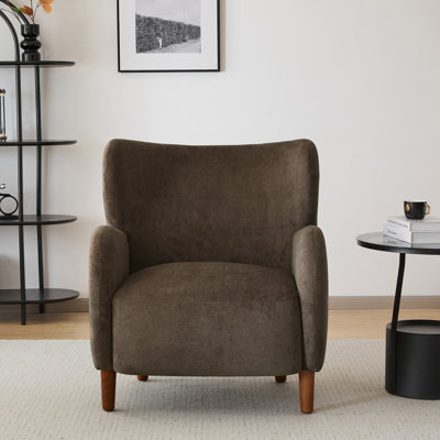 Fauteuil club à oreilles rembourré