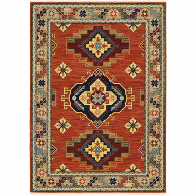 Tapis rouge rouge et oriental tissé à la machine avec franges