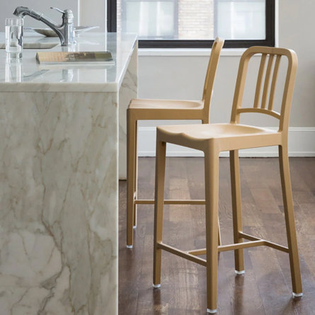 Two tan bar stools at a kitchen counter.