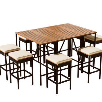 Table d'extérieur en bois et huit tabourets avec accessoires de rouille, coussins de patio toutes saisons