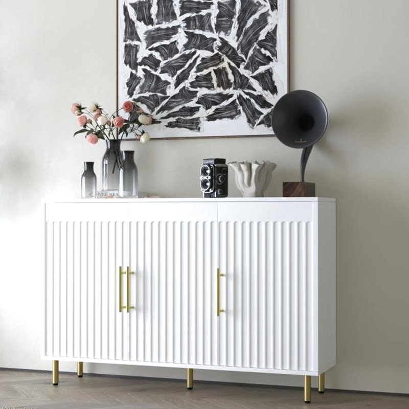 53.7" W White Buffet Cabinet. 3 Doors With Gold Handles. For Various Rooms. Fluted Door Appeal 3-Door Cabinet In White. Handles And Doors. Ideal For Styles. Fits Living, Dining, Kitchen