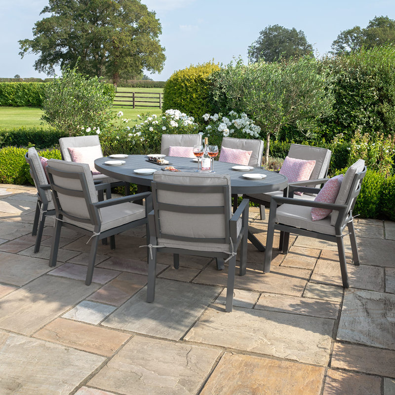 Meziah 8 - Person Patio Dining Set with Oval Table , Cushions Included