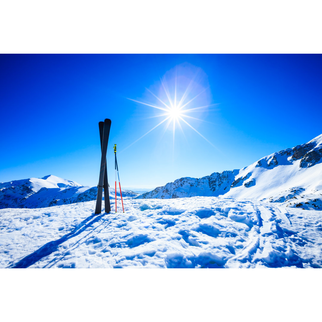 Skis On Top Of Slope Against Sun von Mbbirdy - No Frame Set on Canvas