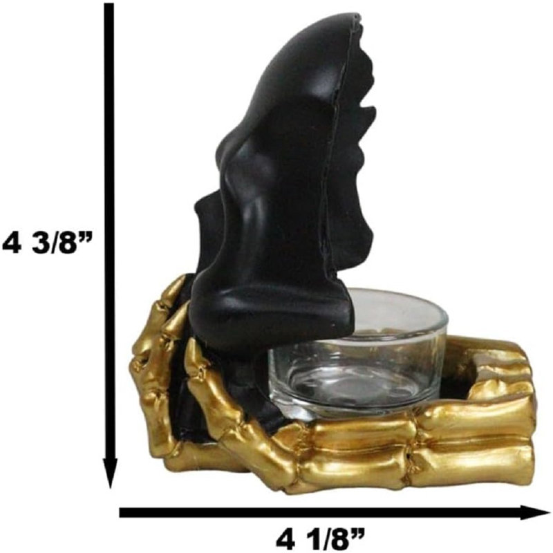 Porte-bougie noir avec masque à tête de mort fantôme noir sur squelette doré