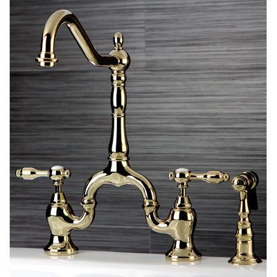 Kingston Brass Tudor Two-Handle 3-Hole Deck Mount Bridge Kitchen Faucet with Brass Side Sprayer