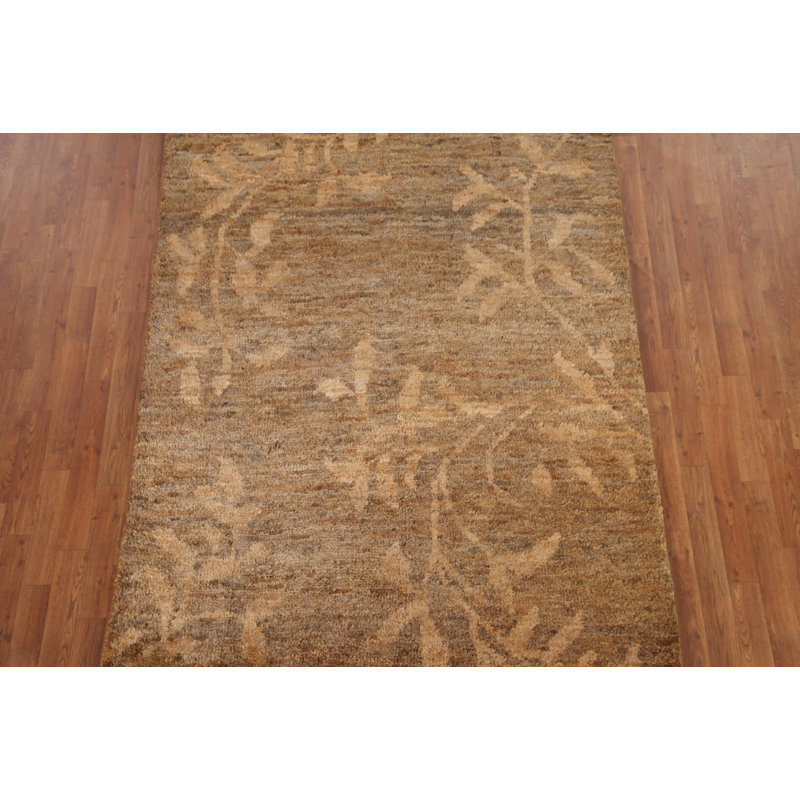 Tapis brun / doré à motif abstrait