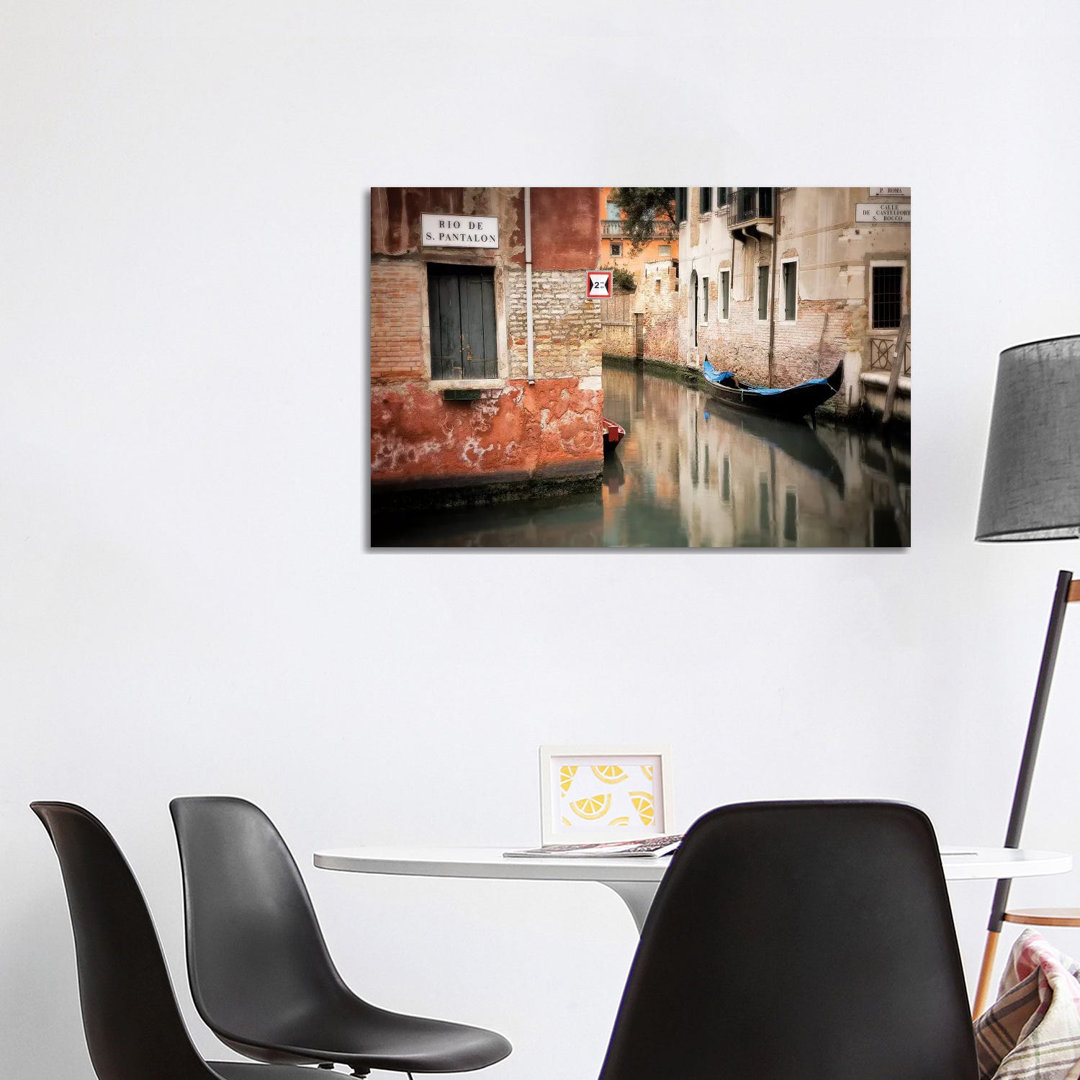 Italy, Venice. Gondola Moored In Canal. by Jaynes Gallery - Wrapped Canvas Print