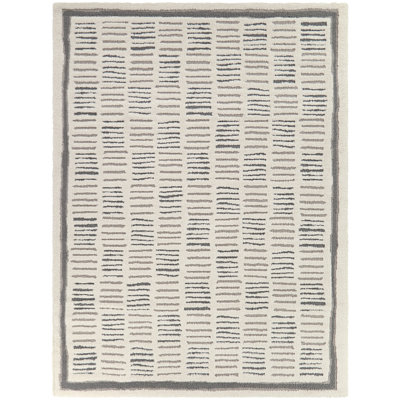 Tapis crème moderne à motif abstrait Guillaume
