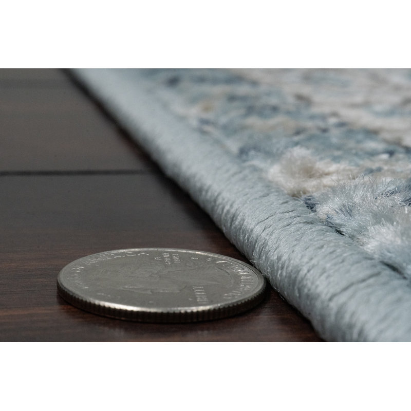 Tapis bleu clair Omarion Southwestern, Rectangle 3 pi 11 po x 5 pi 7 po