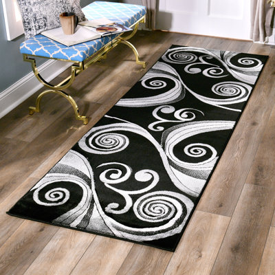 Tapis noir à motif abstrait Adonia