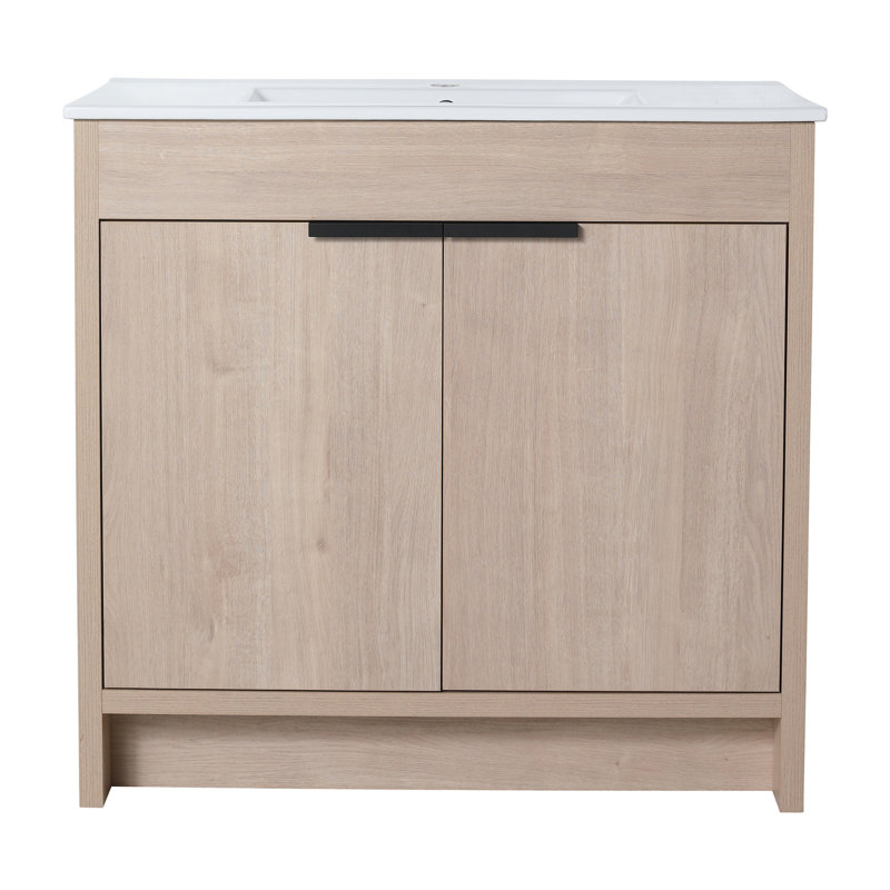 Rangement autoportant pour salle de bain 36 po avec lavabo. Évier en céramique blanche et 2 portes d'armoire à fermeture en douceur. Chêne uni radiant. Tablette réglable. Poignées en métal. Meuble-lavabo extérieur en contreplaqué. Brillant.
