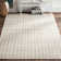 Sanders Hand Woven Wool/Cotton Floral Rug in Gray/Ivory