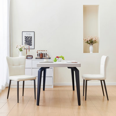 Ensemble de 2 chaises de salle à manger à haut dossier avec design ergonomique: structure en fer forgé, siège en cuir et coussins en éponge à rebond élevé