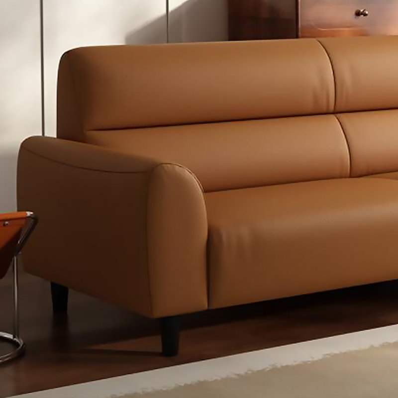 Canapé double en cuir orange, équipé de coussins, H 32,68 po x l 66,93 po x P 31,5 po