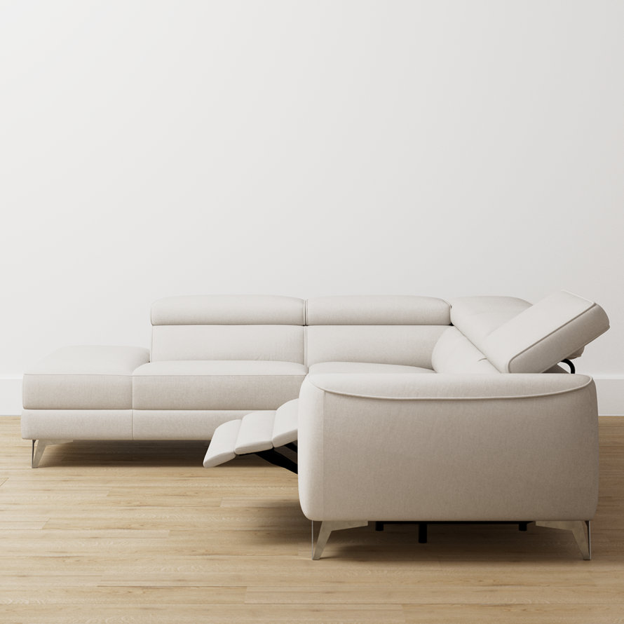 Off-white sectional with extended recliner footrest.