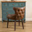 Fauteuil demi-tonneau capitonné à dossier capitonné