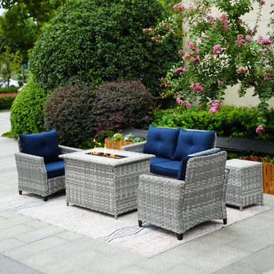 Woodrum Wicker 4 - Person Patio Conversation Set with Cushions