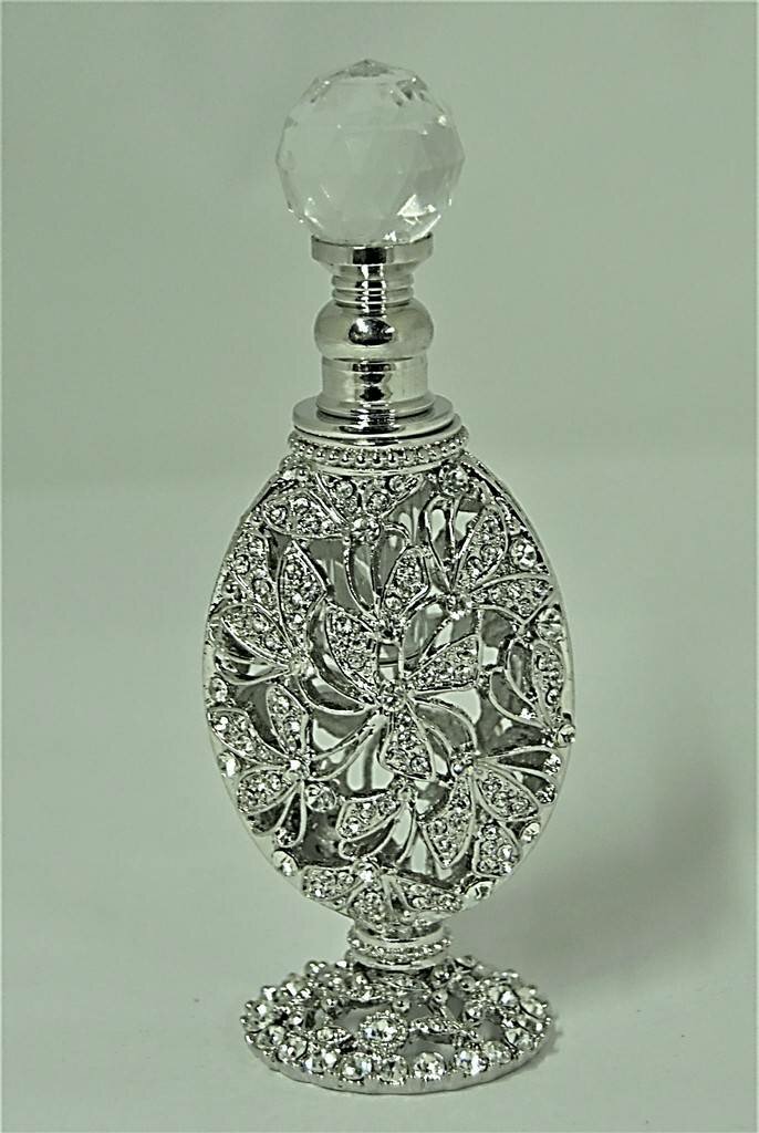 Fancy rich look allured to crystal perfume bottle with golden handcrafted  designer pattern and silver collar lovely opulent gift souvenir