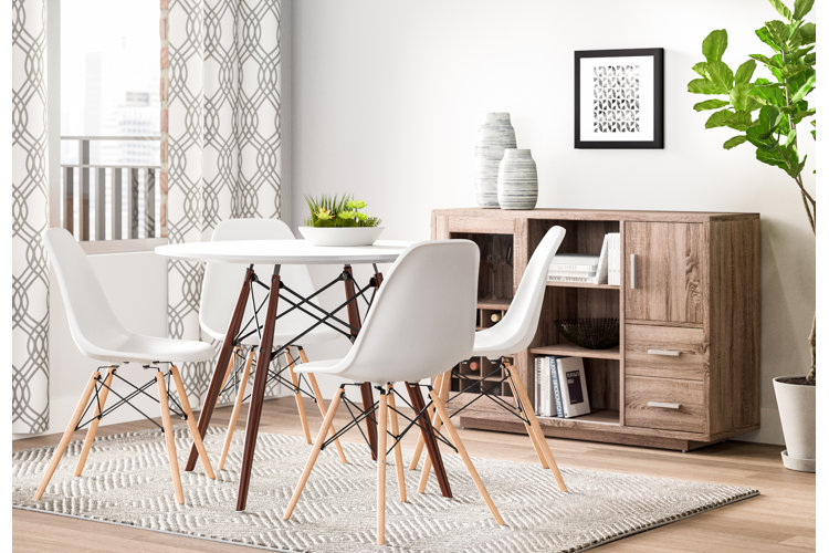 small dining room with a round table and armless chairs