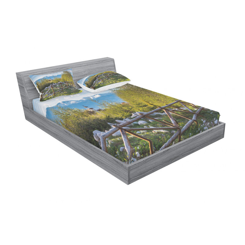 Ensemble de draps idyllic avec table de planche et snow mountain range