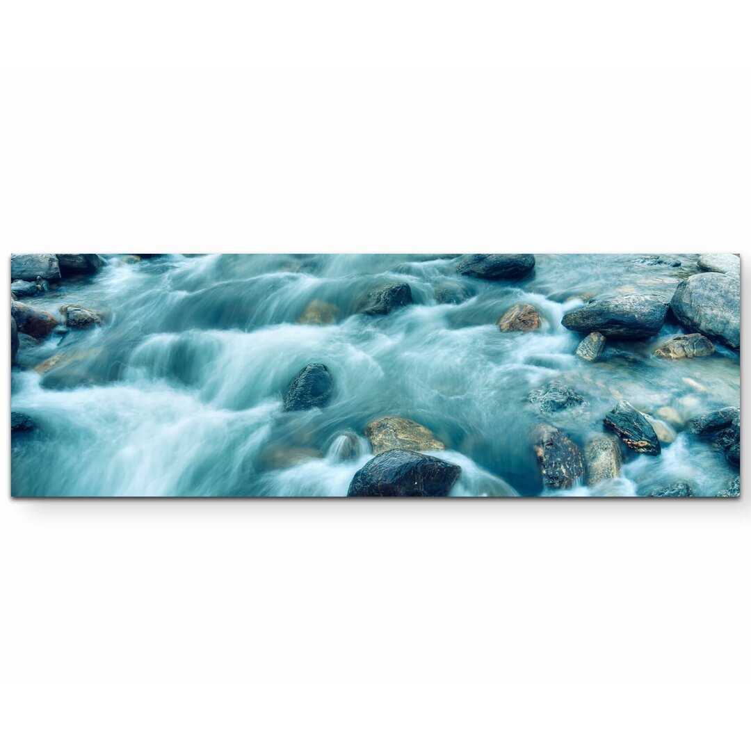 Leinwandbild Flussströmung zwischen Steinen