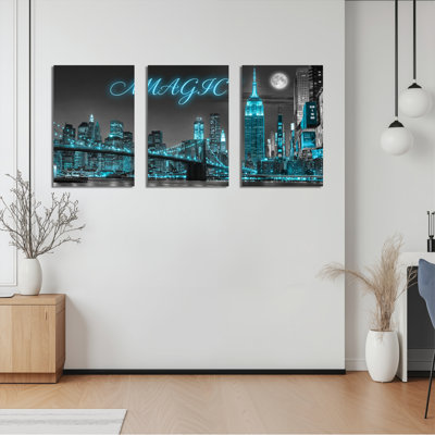 Ensemble de 3 tableaux sur toile bleu néon représentant la silhouette de Magic City, pour la décoration du salon et de la chambre.