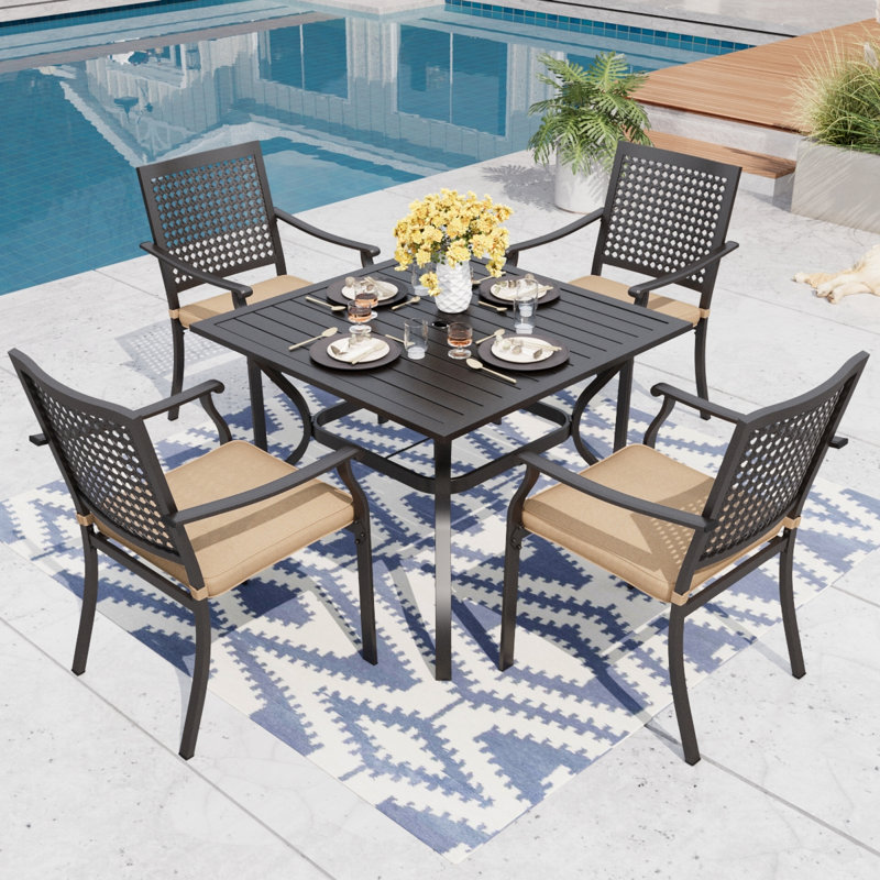Argyri 4 - Person Patio Dining Set with Rectangular Table , Cushions Included