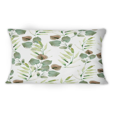 Coussin décoratif tropical à motif de feuilles vertes sur fond blanc