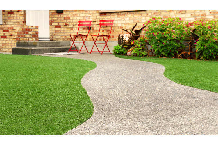 beautiful green turf grass next to a pathway
